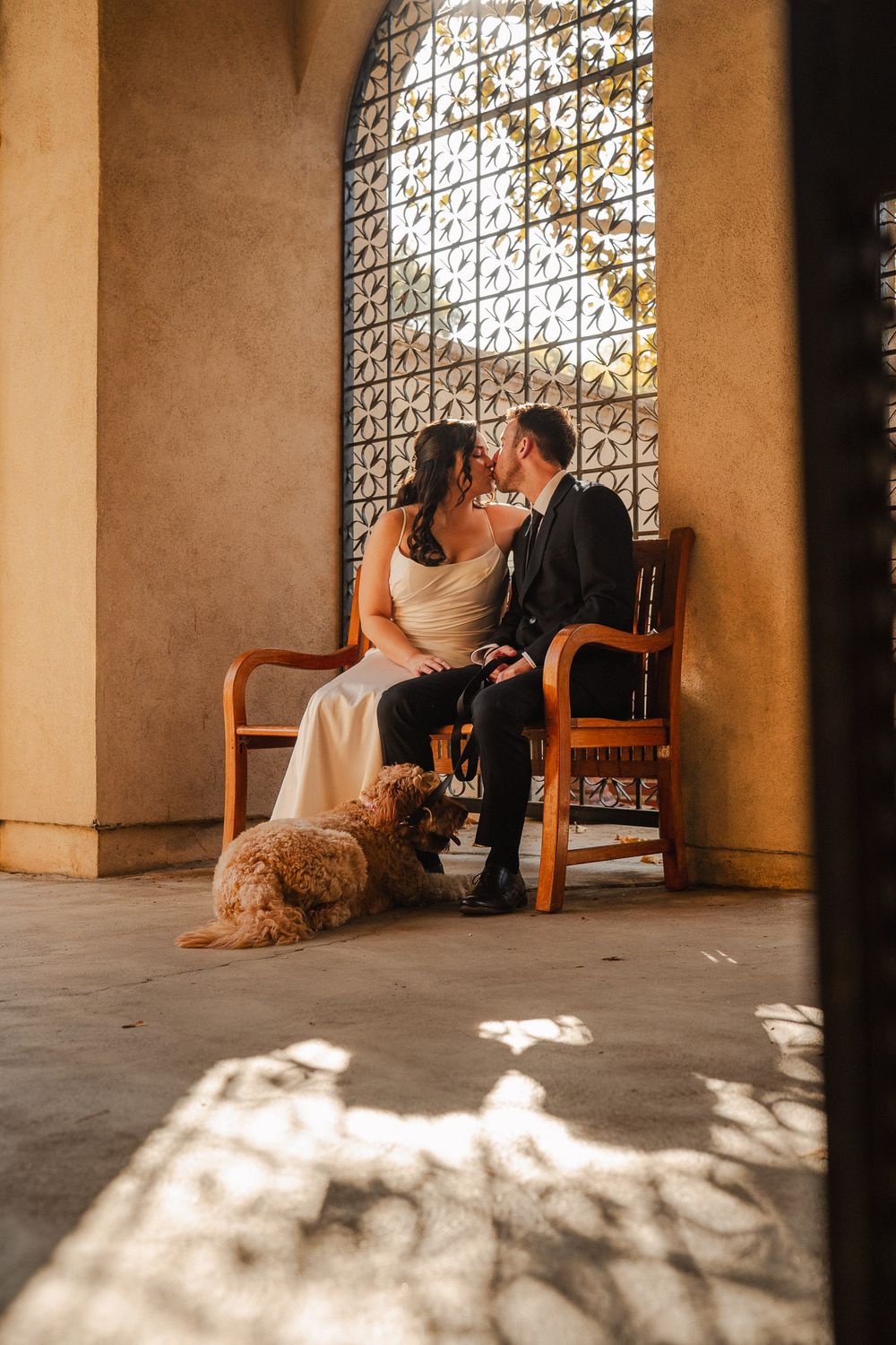 Bride and groom sitting together at their Pasadena wedding captured in film inspired tones