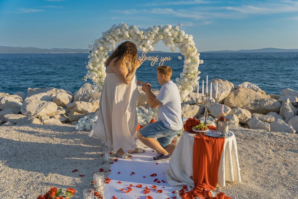 Split Beach Proposal flower heart arch with picnic and photosession