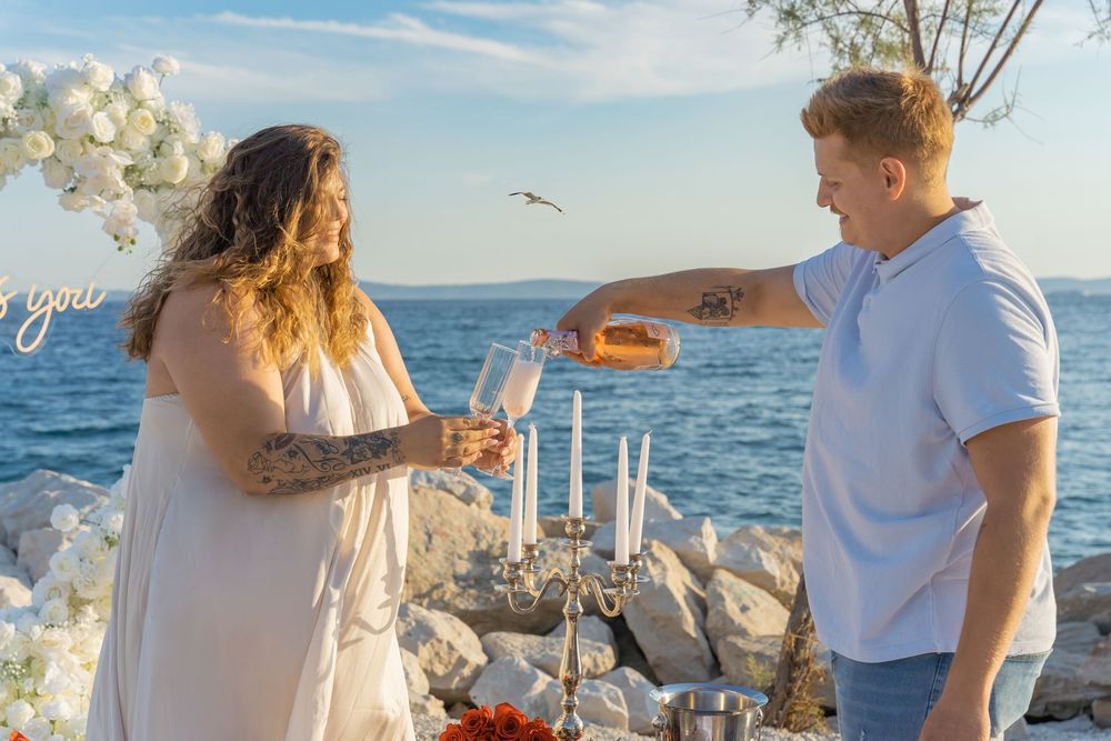 Split Beach Proposal flower heart arch with picnic and photosession