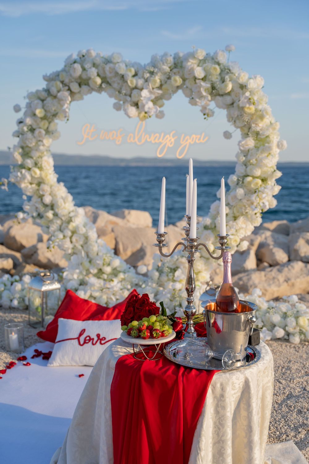 Split Beach Proposal flower heart arch with picnic and photosession
