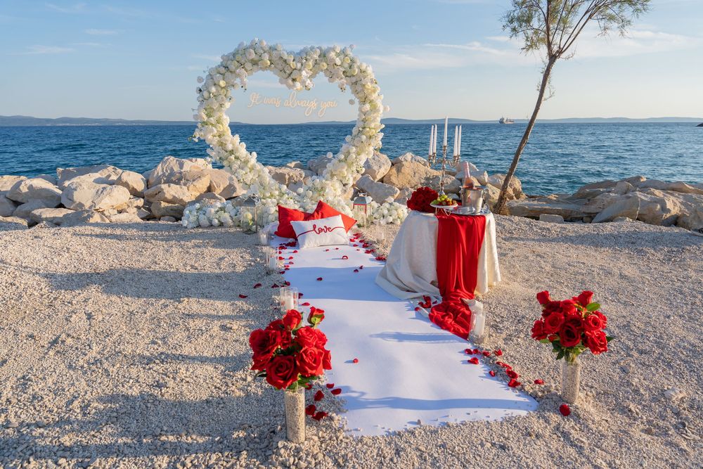 Split Beach Proposal flower heart arch with picnic and photosession