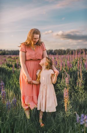 Family photos in a lupine wildflower field during their photography session near Seattle, Washington in spring season