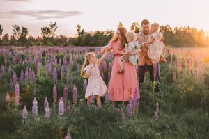 Family photos in a lupine wildflower field during their photography session near Seattle, Washington in spring season