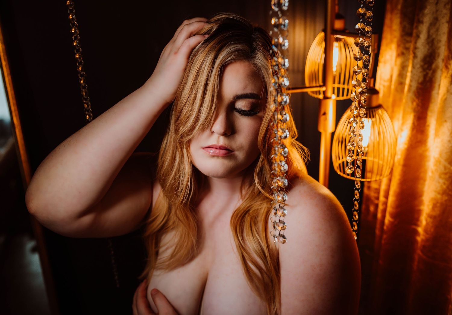 Beautiful dark and moody portrait of woman taken by Boudoir by KJ in Hudson Wisconsin.
