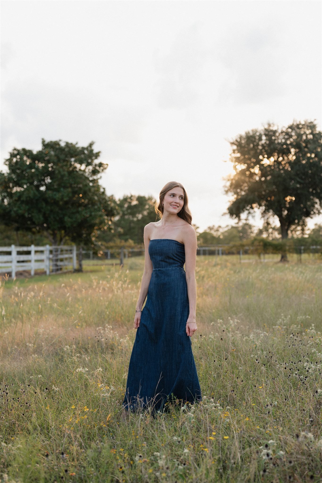 The Woodlands High School girl posing for senior pictures in Magnolia, Texas