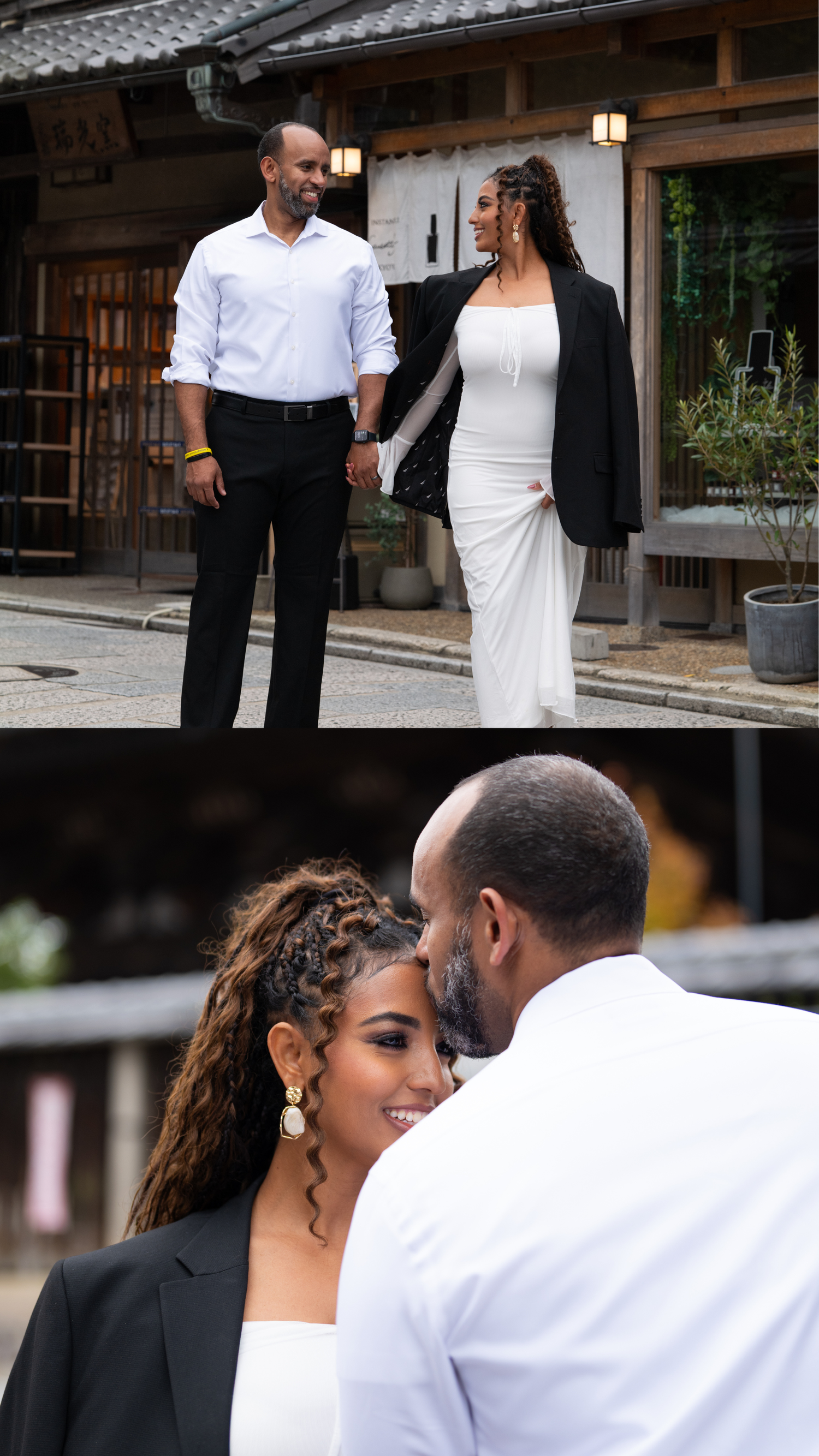 Couple in elegant attire holding hands on a Japanese street, woman in white dress and black blazer.