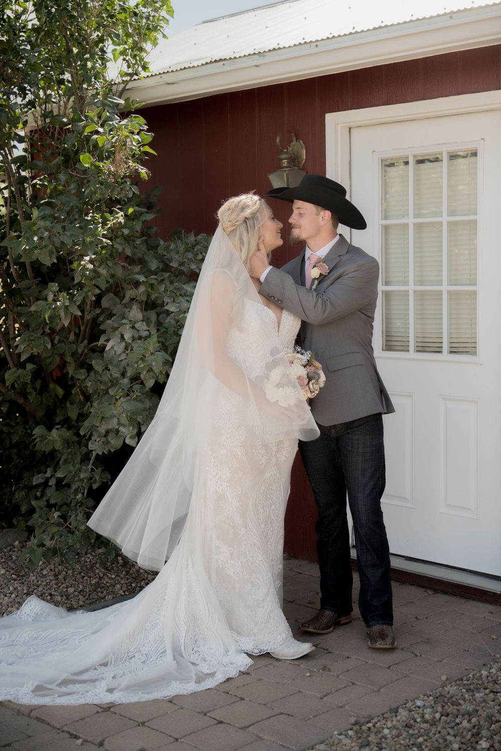 A romantic wedding first look sequence showing a bride and groom meeting outside a white garage door.