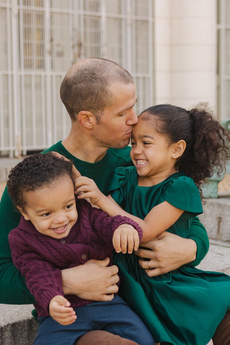Family posed near Prospect Park Boathouse steps by NYC family photographer