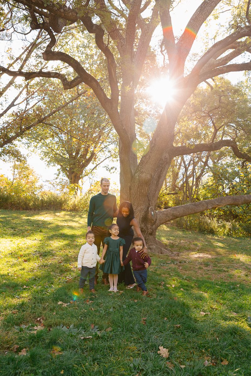 Siblings hugging and smiling in Prospect Park family portraits in Brooklyn