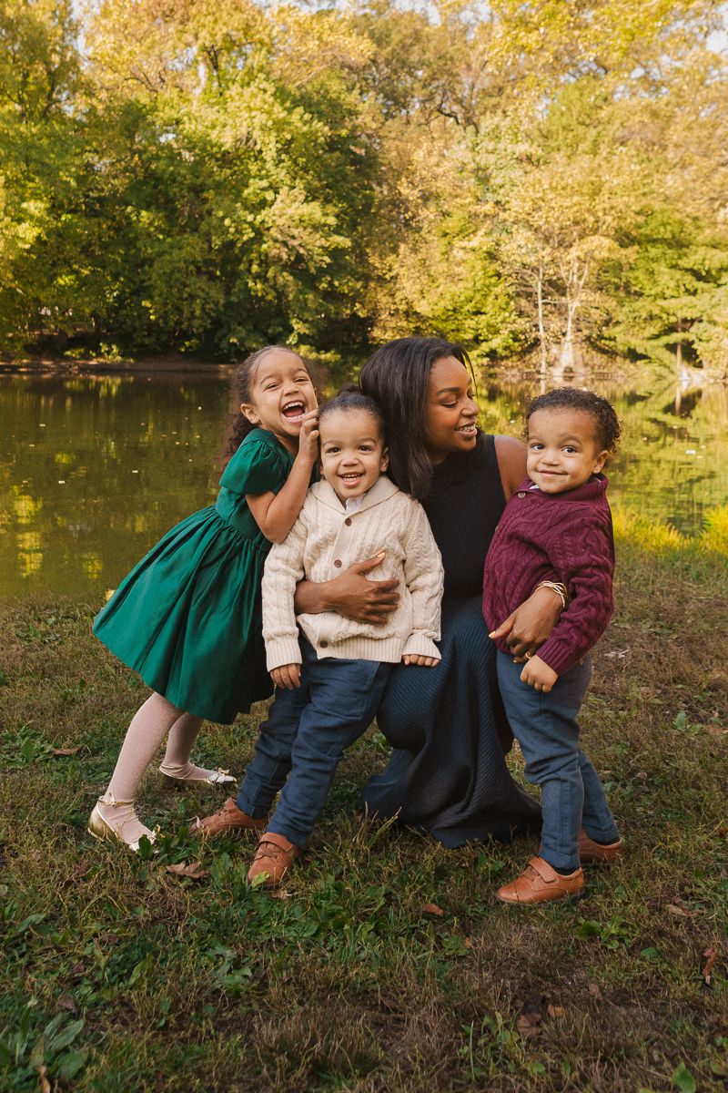 Family of five walking together in Prospect Park, Brooklyn during a relaxed photo session