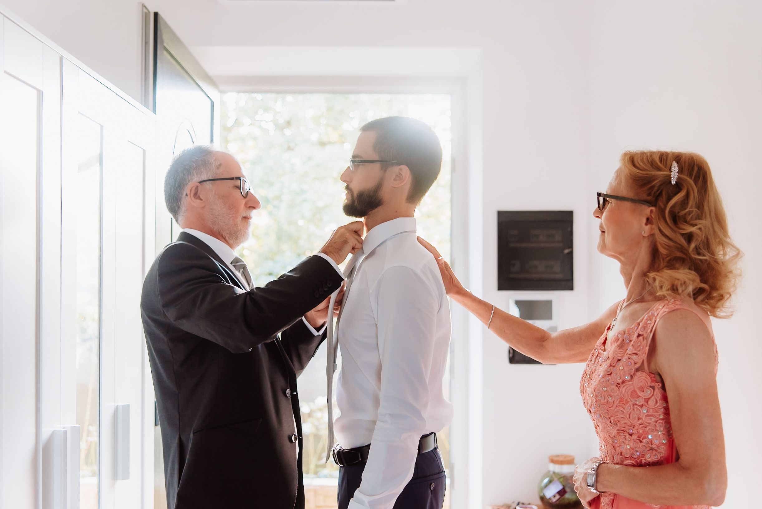Wedding guests mingle and socialize during an elegant indoor reception celebration.