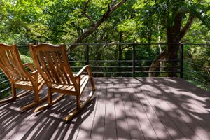 Covered terrace with outdoor furniture, ideal for enjoying the views and fresh air in a gated community in Atenas