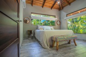 Bed beautiful tropical garden with exotic plants and flowers in a gated community in Atenas. A natural paradise