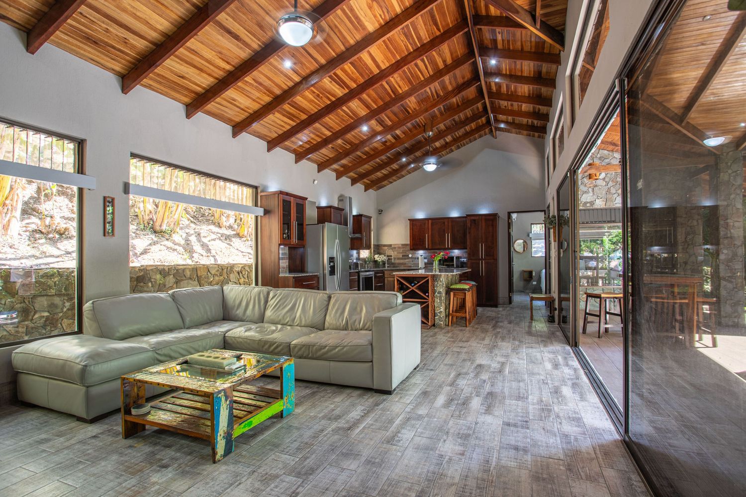 Spacious and bright living room with modern design and artistic touches in a gated community in Atenas. Perfect for entertaining