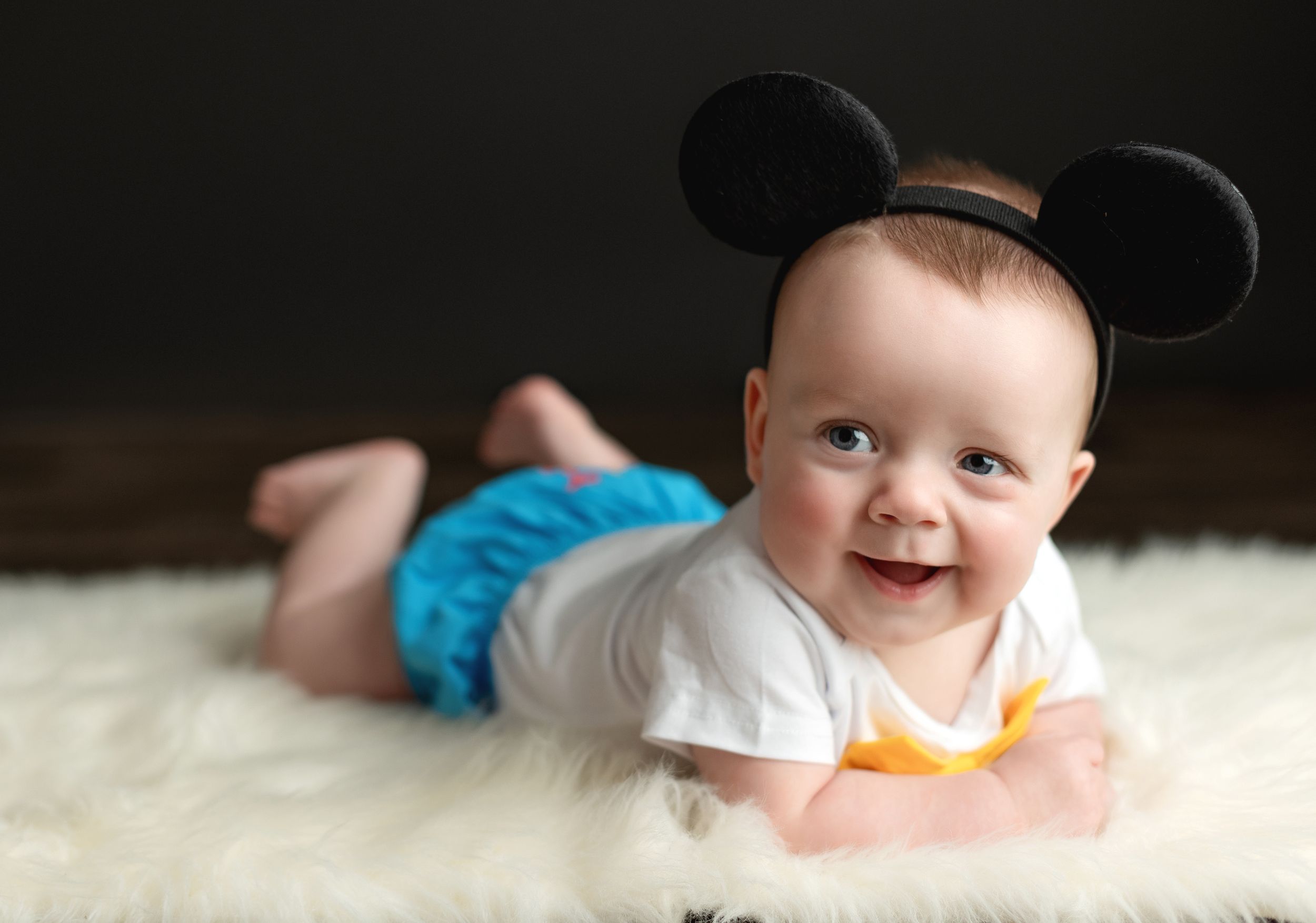 One year smiling with Mickey ears. Greenville SC newborn photographer, Easley SC newborn photographer