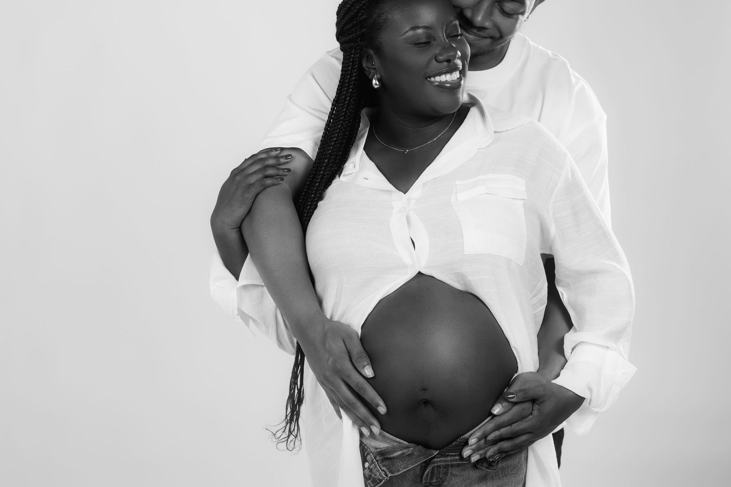Black and white artistic portrait series showing intimate poses and expressions against a minimalist background.
