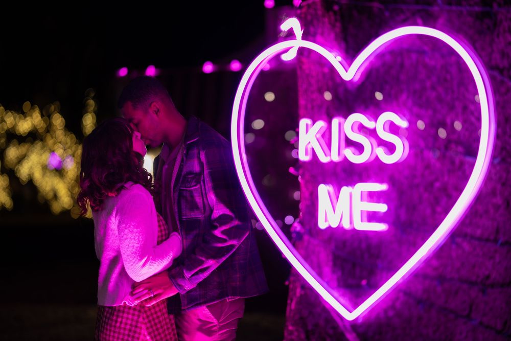 Pink neon heart signs with romantic text glowing against dark backgrounds in a collage format.