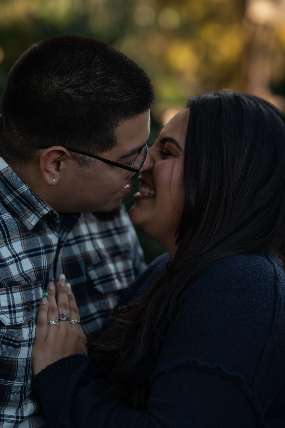 A couple shares a tender romantic moment in a series of progressive shots showing them leaning in for a kiss.