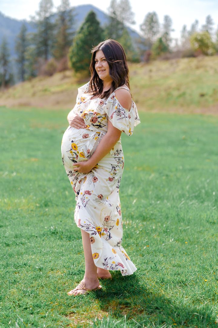 maternity portrait of mom with a floral dress