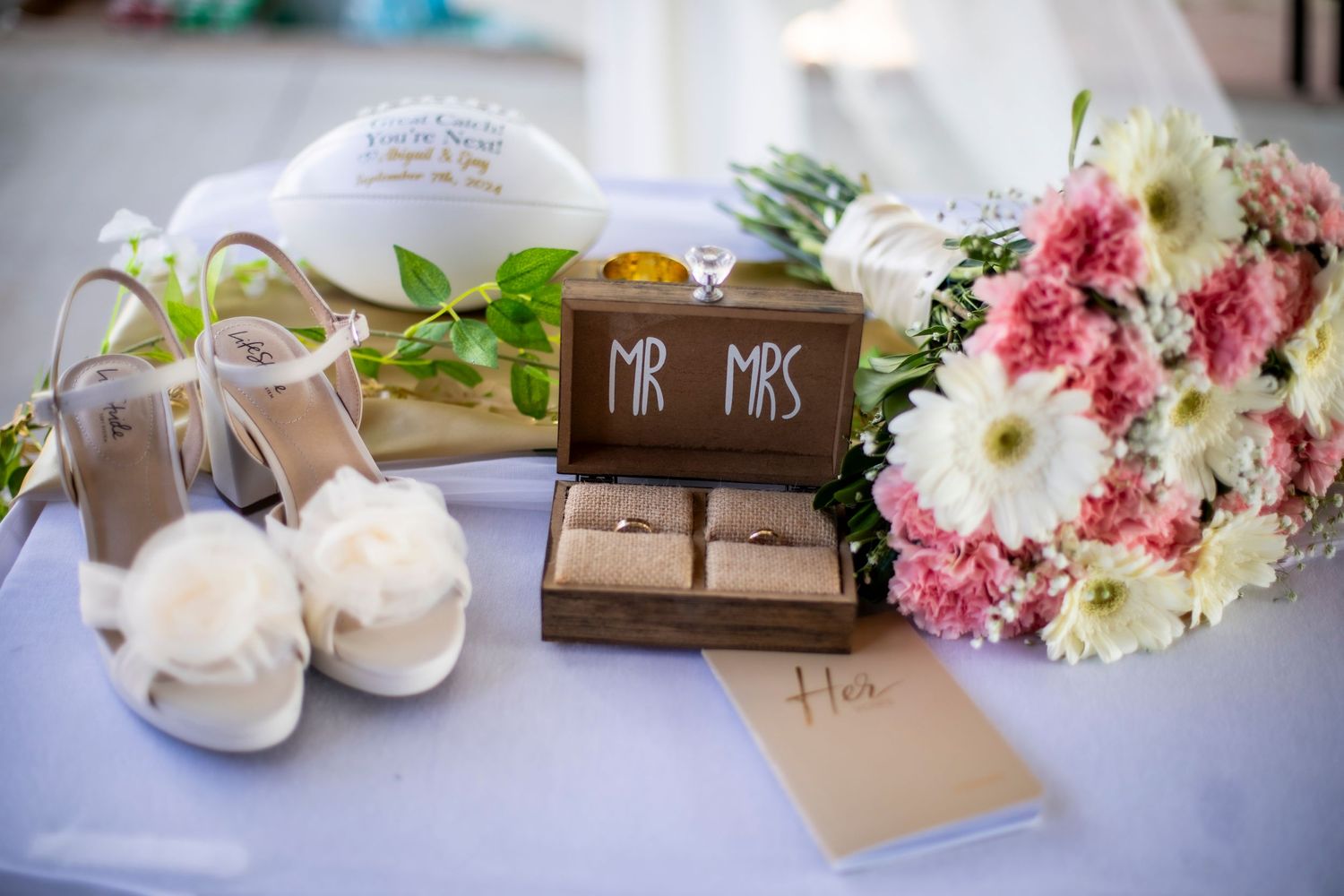 Romantic wedding photography in El Paso – getting ready details of the wedding rings, vows, bouquet, and shoes
