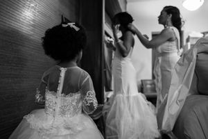 Black and white photos capturing intimate moments during wedding preparations.