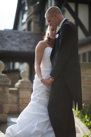 Series of candid wedding photos showing a couple in formal attire interacting outdoors near stone architecture.