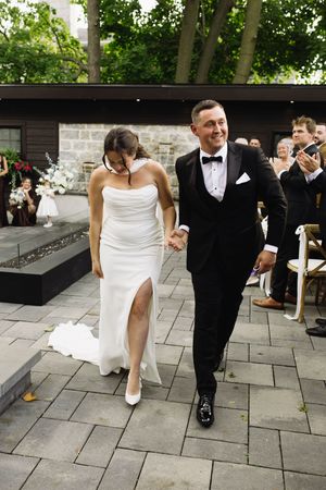 bride and groom walking down the isle