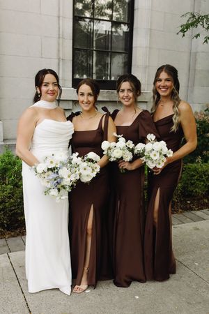 bride and bridal party posing