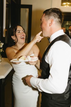 couple wedding cake fun