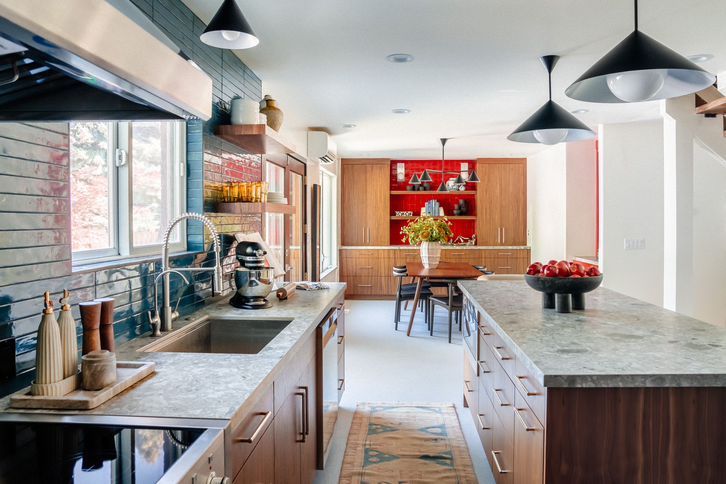Modern office interior with white walls, pendant lighting, and wood accents showcases an open floor plan design.