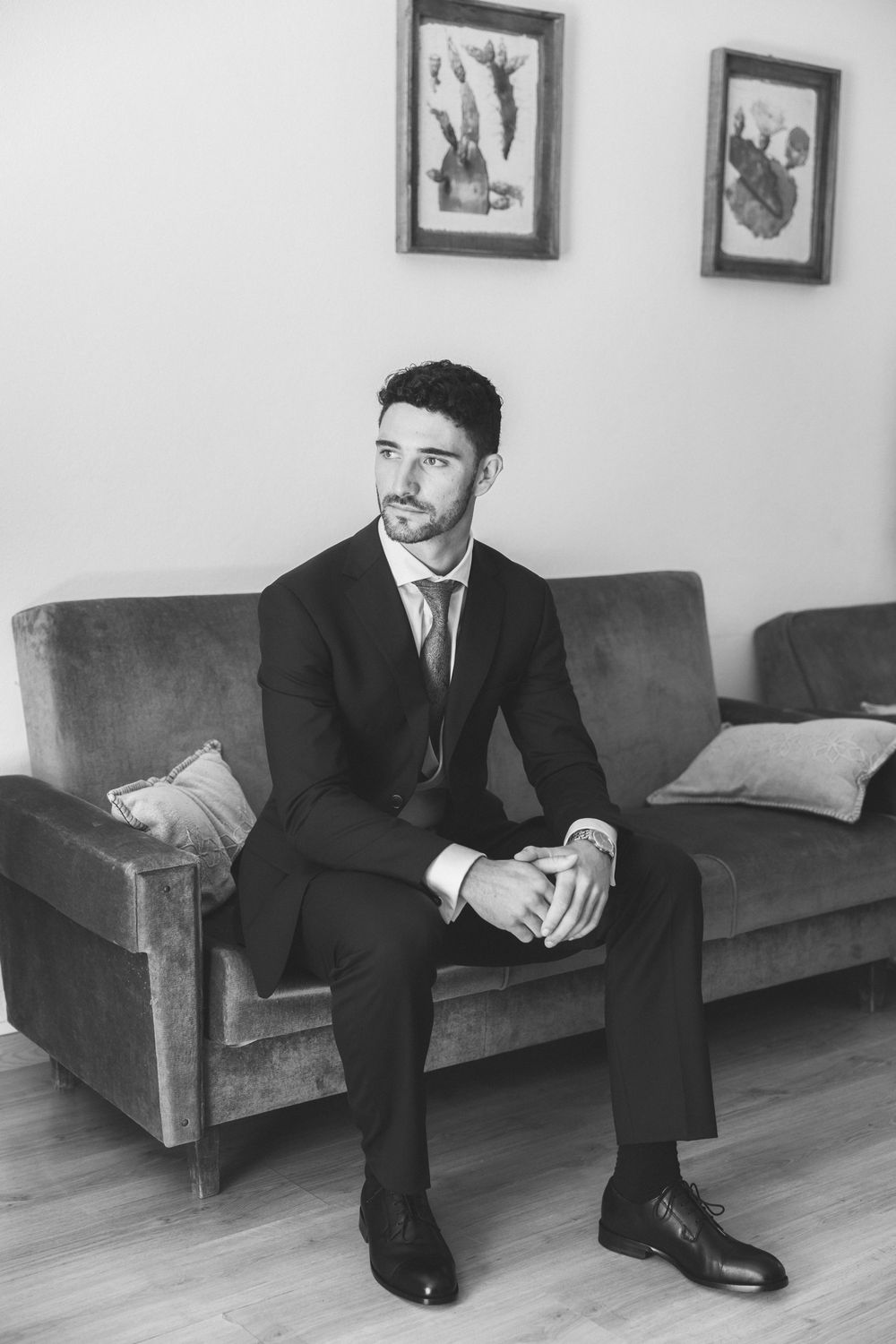 Black and white groom portrait during wedding preparations in Portugal