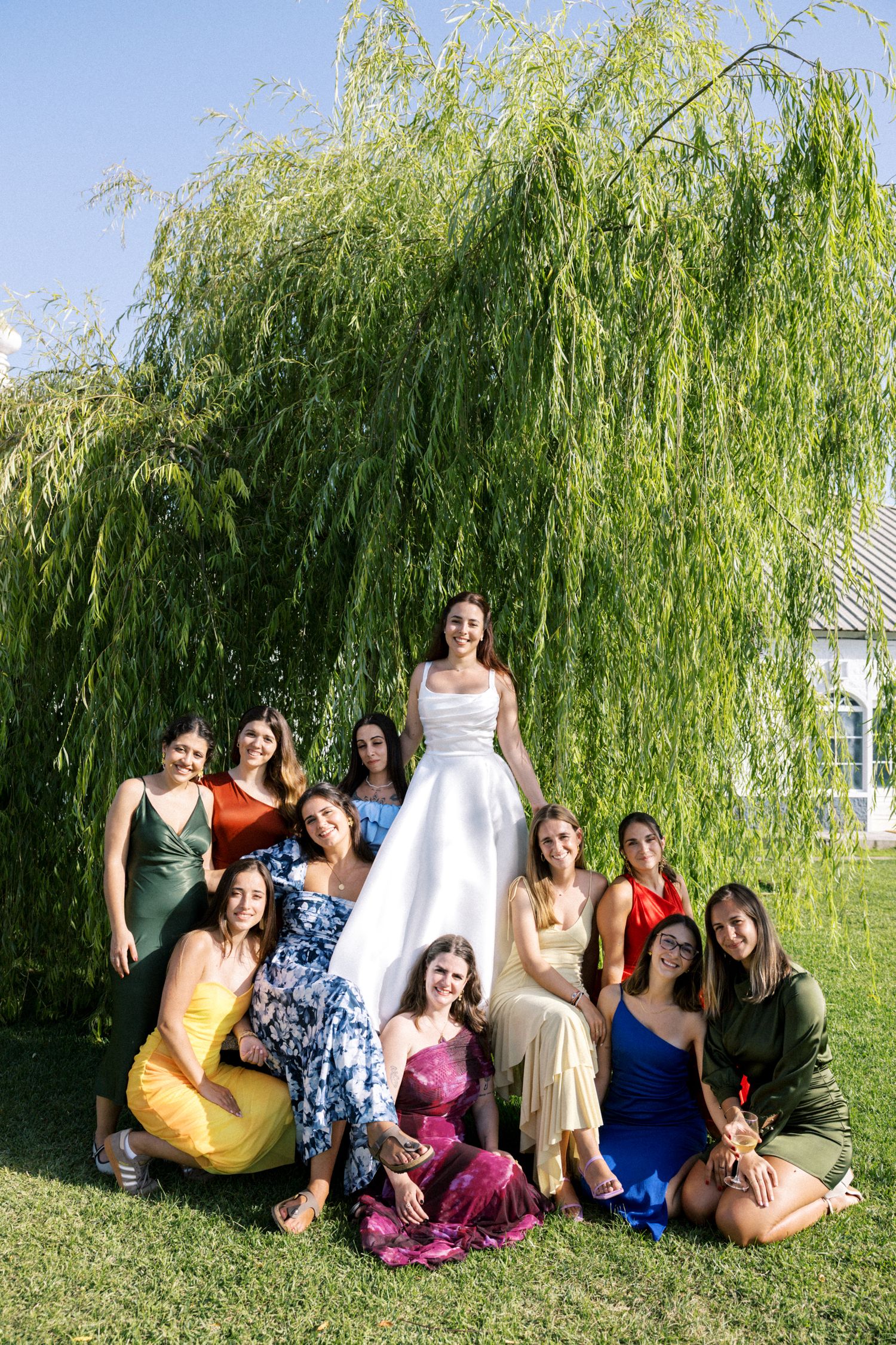 Bride with bridesmaids in colorful dresses at Palácio da Bacalhôa wedding Portugal