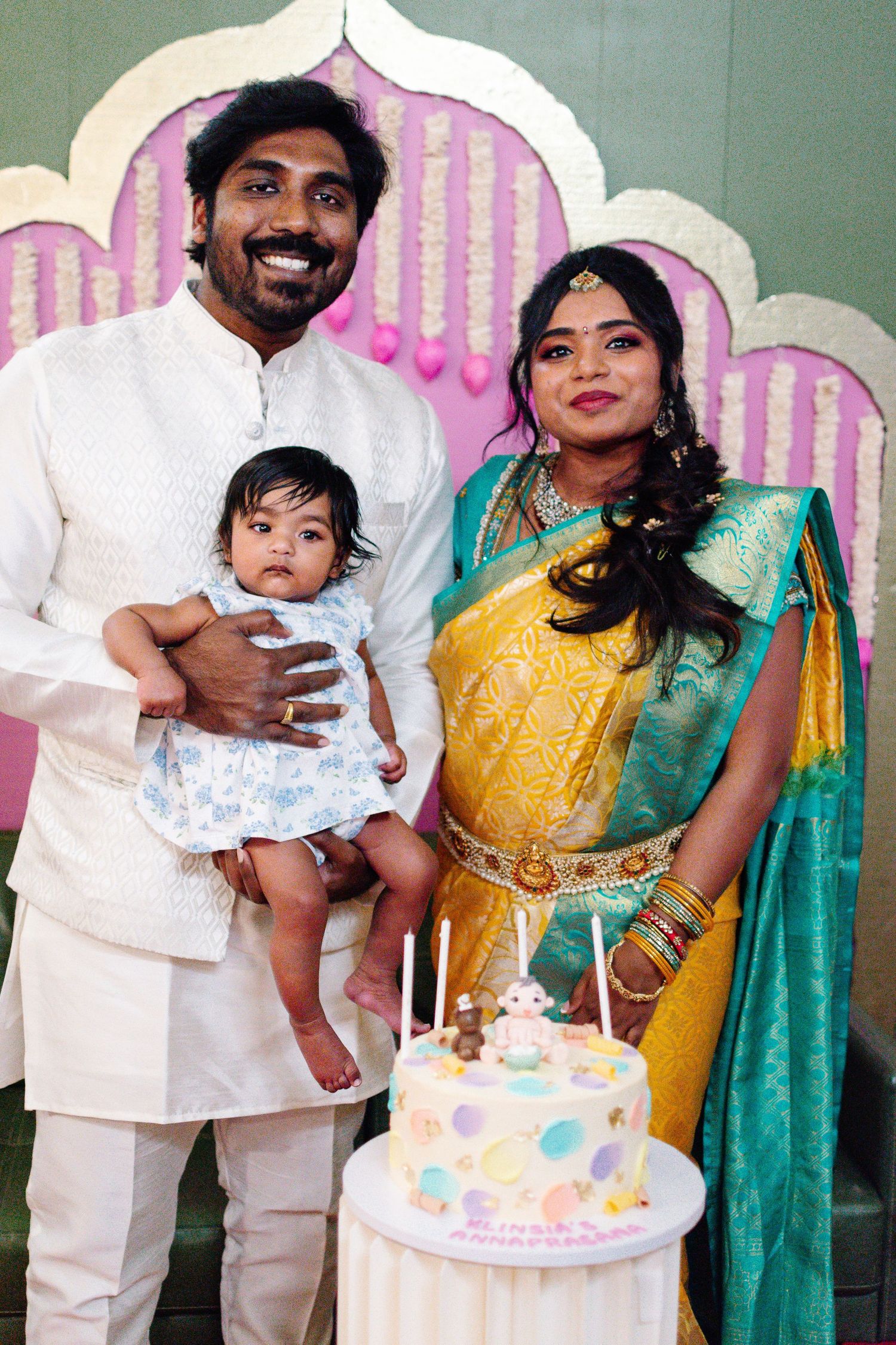 Parents with their baby during traditional Annaprashana first food ceremony in Everett, WA.