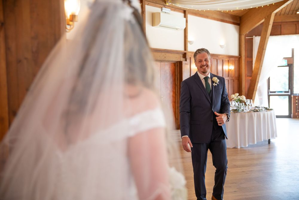 Elegant wedding venue hallway decorated with string lights and white drapery creating a romantic atmosphere.
