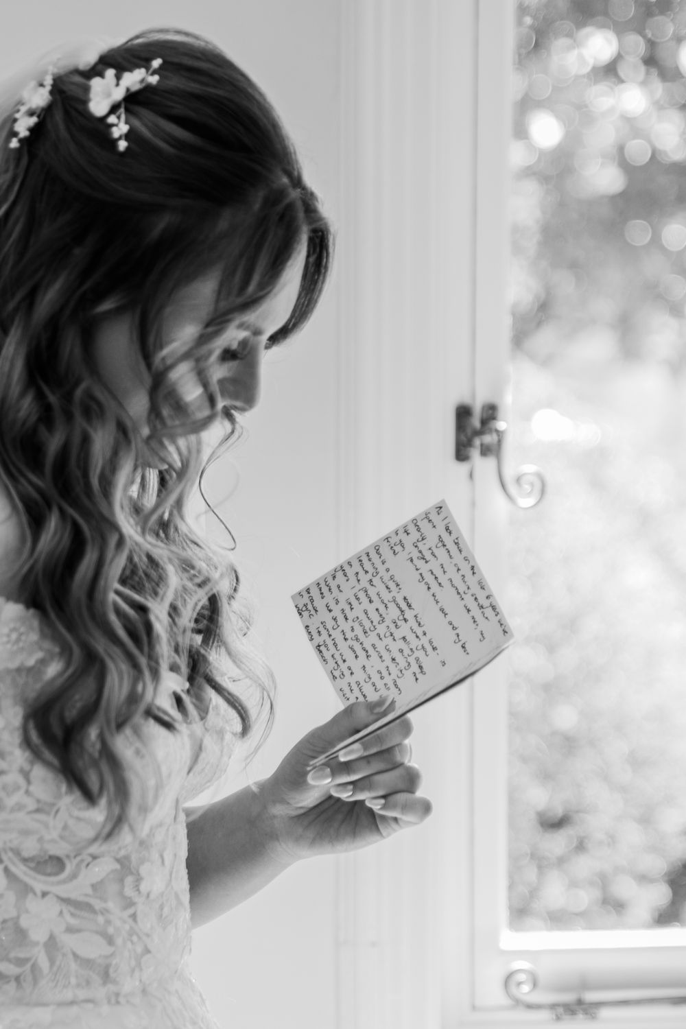 A sequence of black and white images showing a person holding and reading a handwritten letter by a window.