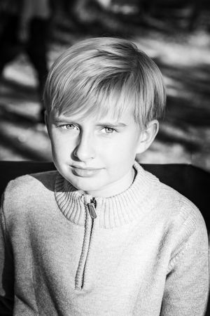 Black and white close-up portraits showing different expressions.