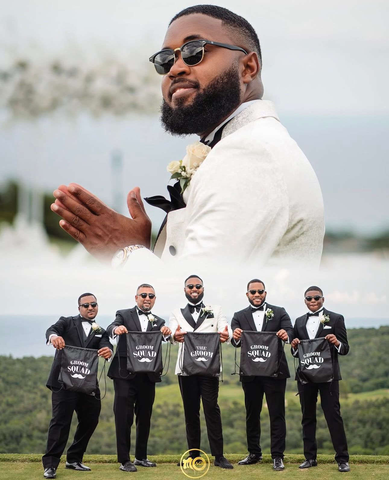 Groomsmen in black suits pose playfully with signs on a grassy hilltop.