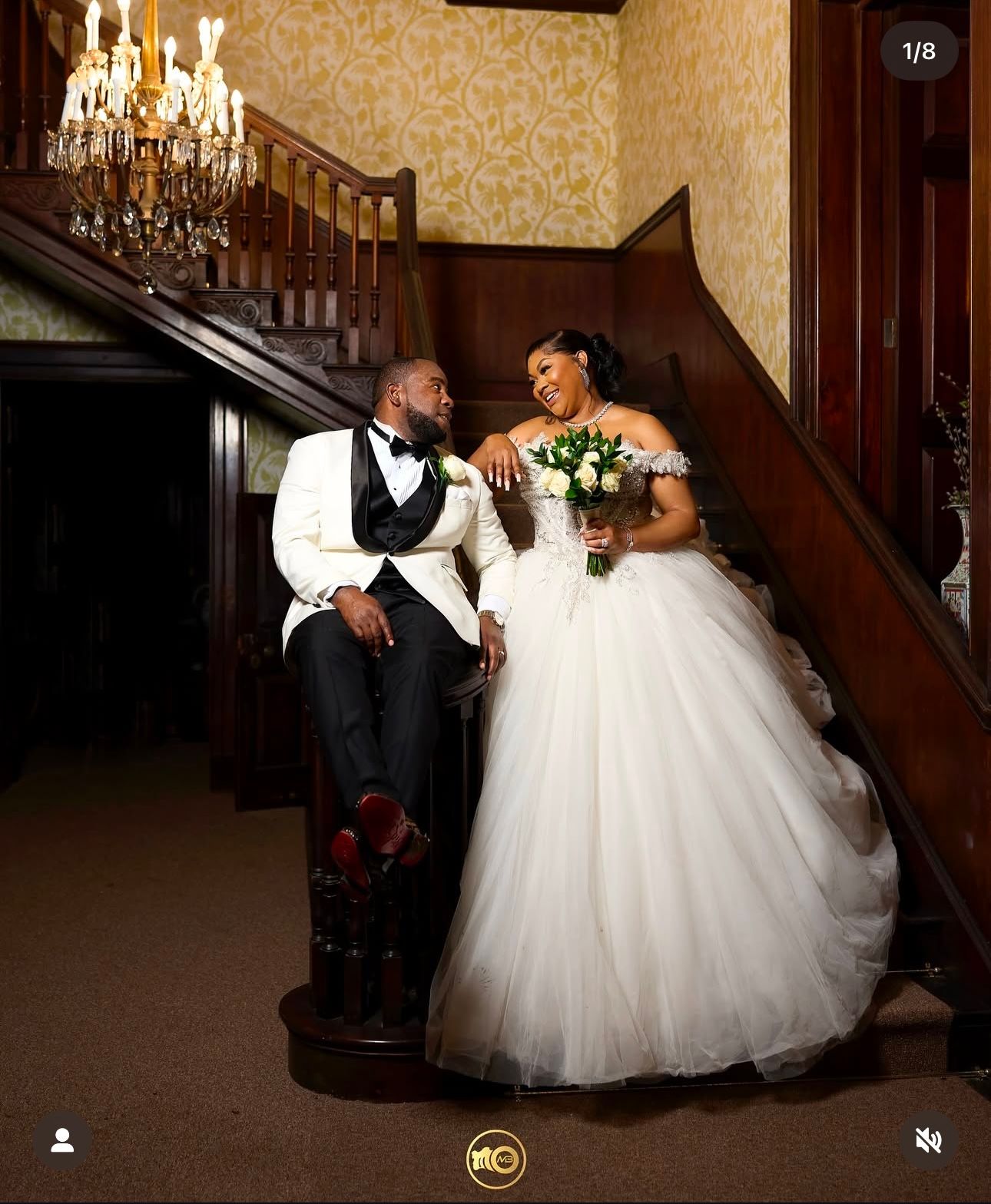 Romantic wedding photos on vintage staircase with chandelier backdrop.
