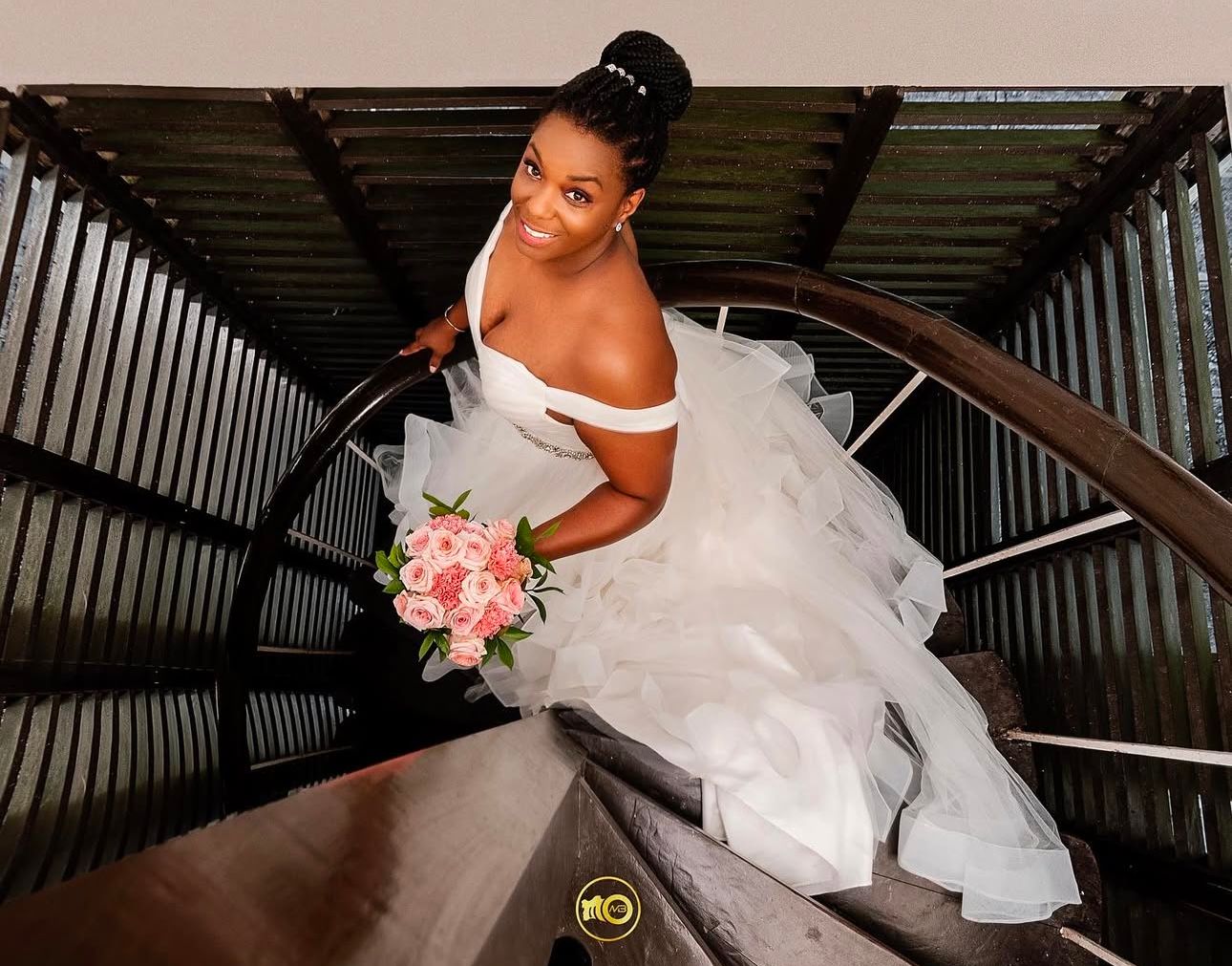 Dramatic wedding photos on rustic wooden staircase.