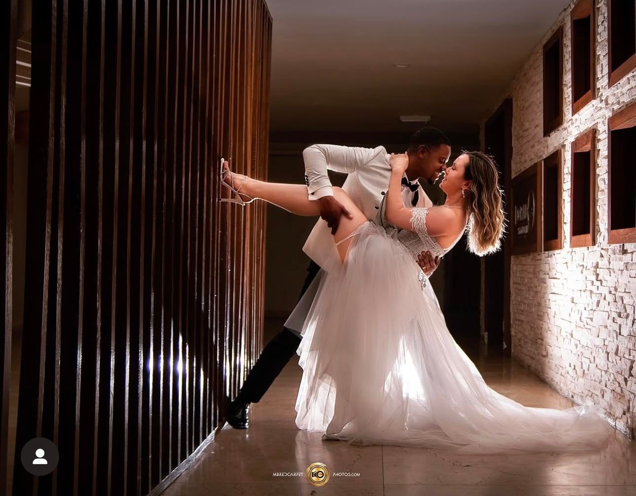 Artistic silhouette dance sequence in dramatic indoor lighting.