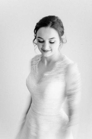 Ethereal black and white bridal portrait with soft lighting and delicate details.