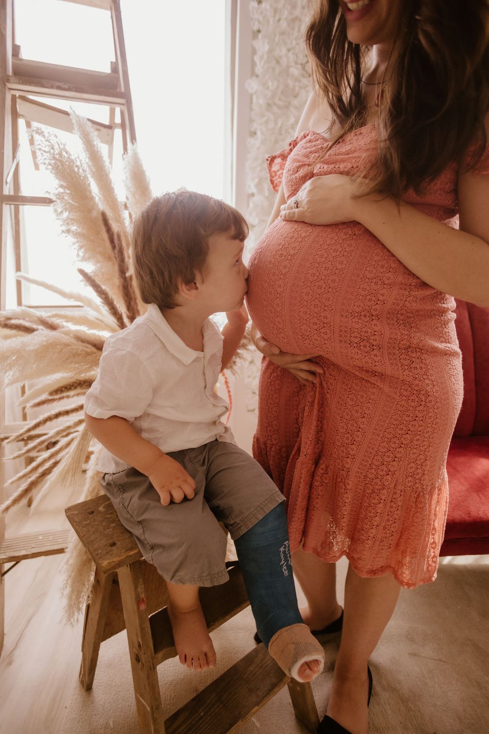 A warm-toned photo series showing tender moments between parent and toddler in natural window light.