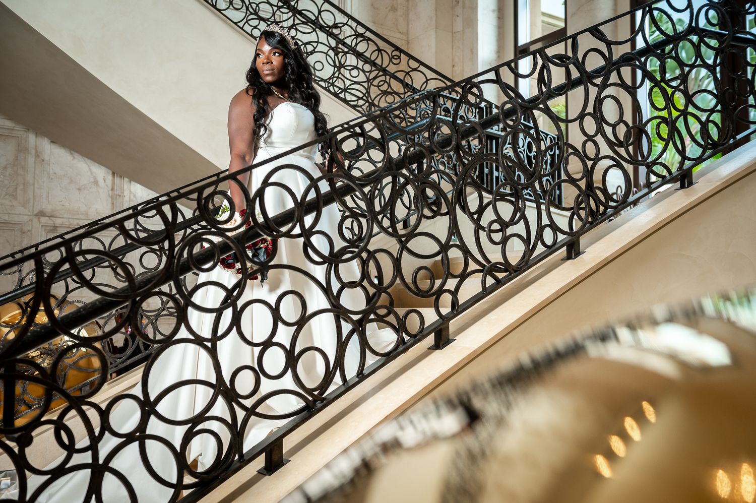 Ballroom reception setup with floral chandeliers at an upscale Orlando venue, photographed with editorial detail.