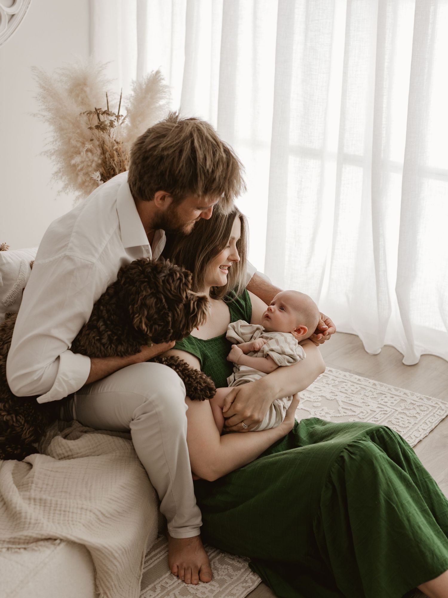 A series of intimate photos showing tender moments on a white bed with someone wearing a green dress.