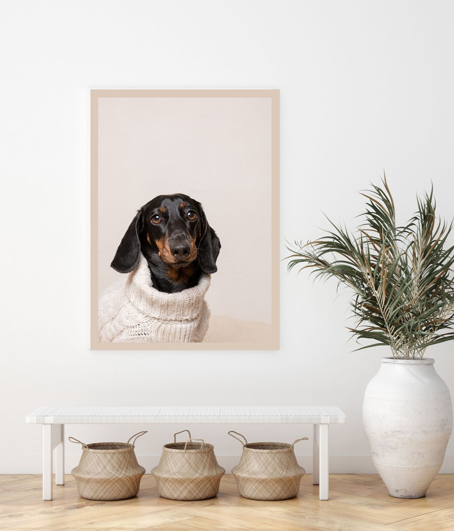 Two vintage-style portrait photographs featuring retro sunglasses hang above white cushions on a wall.