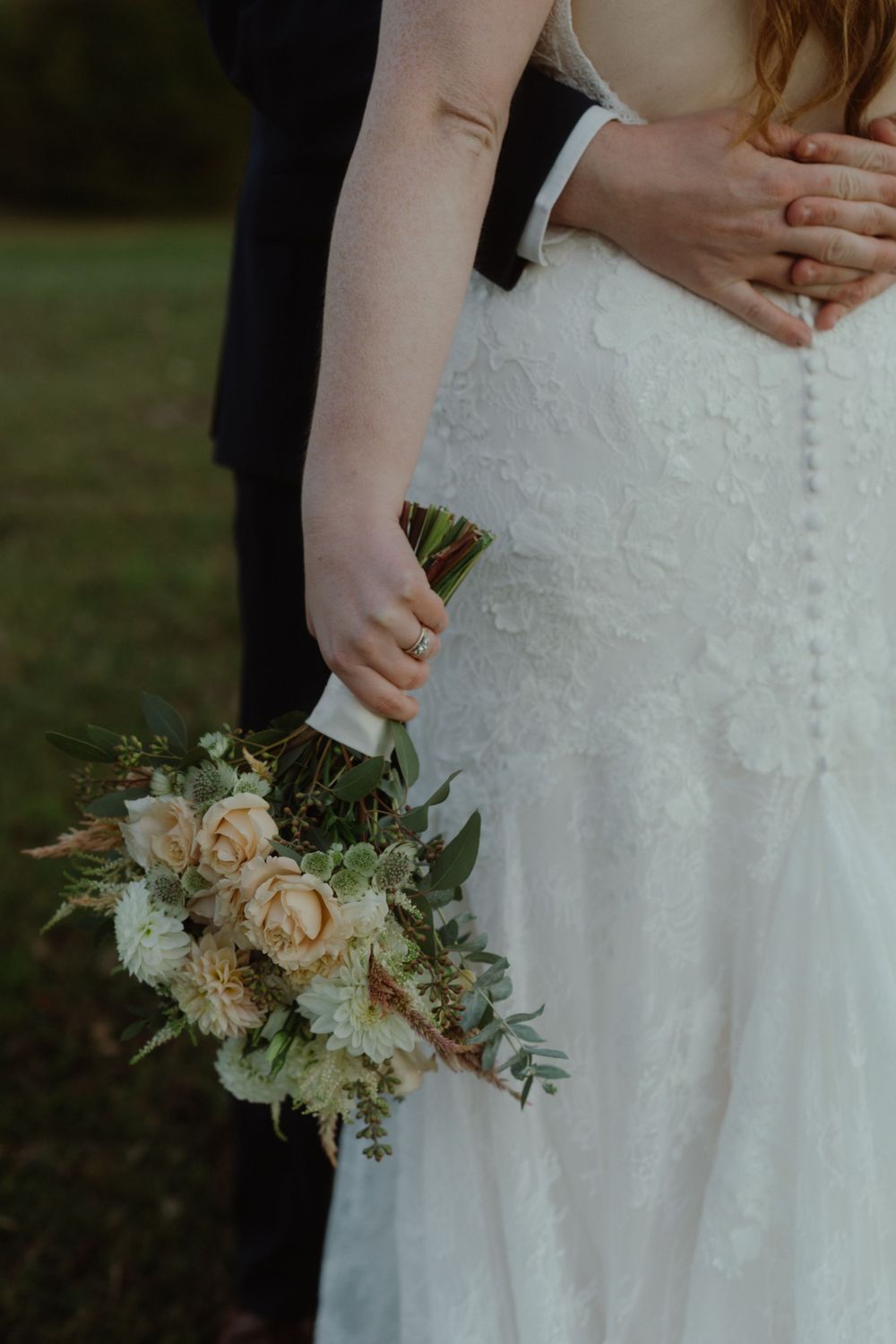 Detailed and cinematic photo of a bride holding her bouquet on her intimate wedding day in Canada.