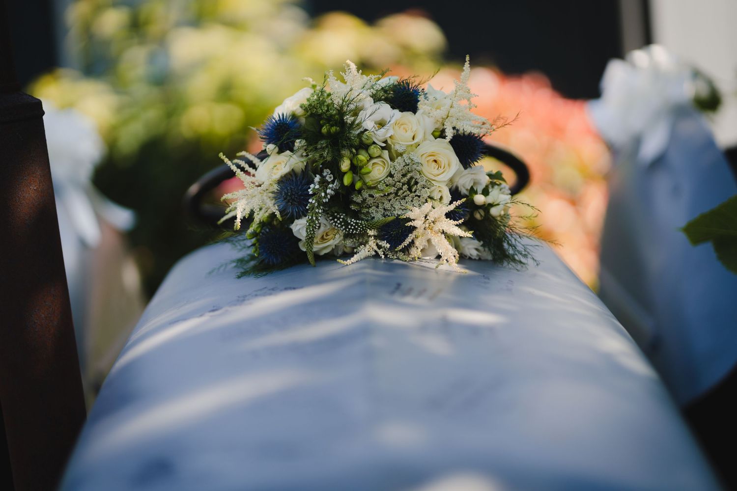 White and cream floral arrangement decorating a formal event.