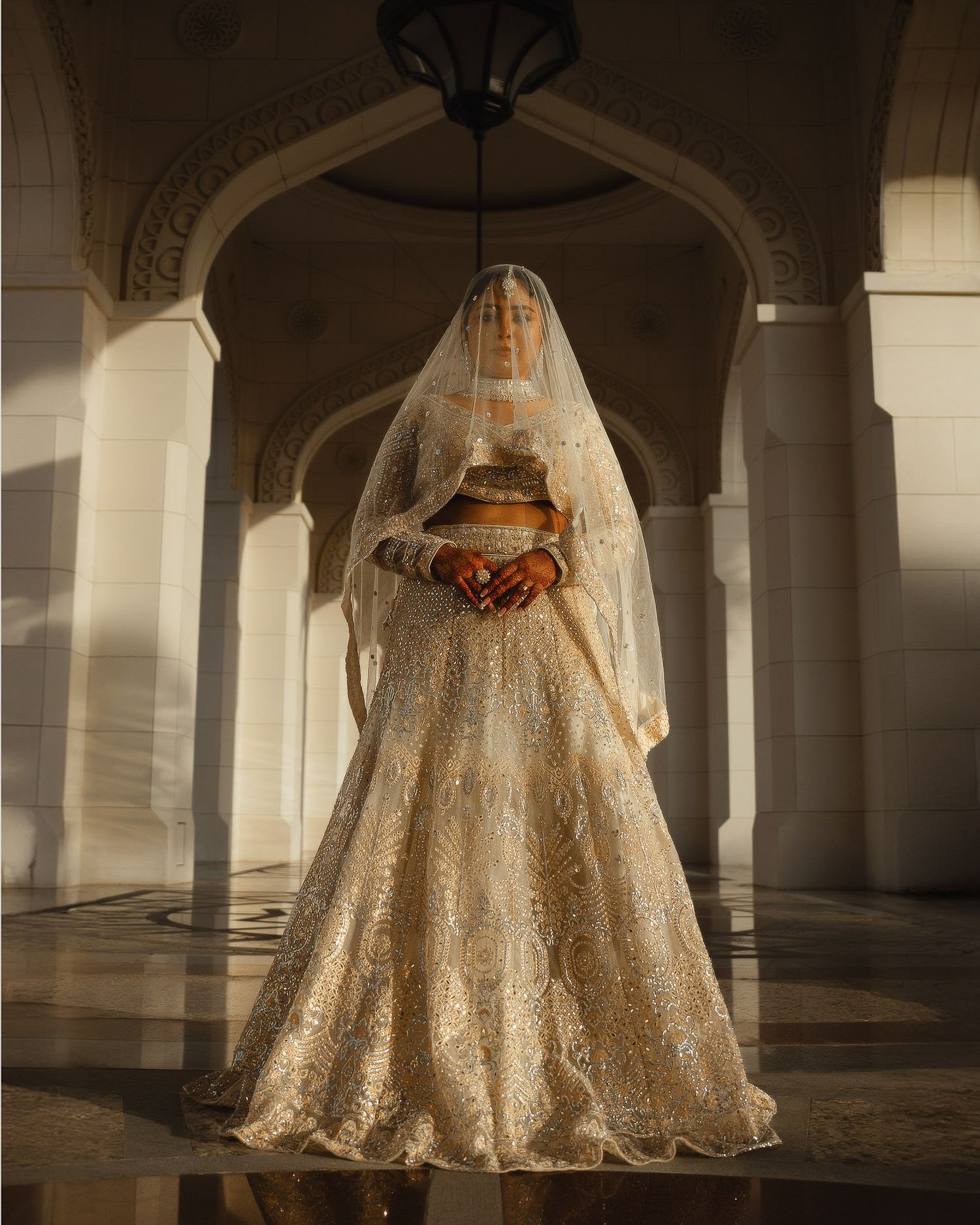 Elegant bridal portrait in dramatic architectural setting
