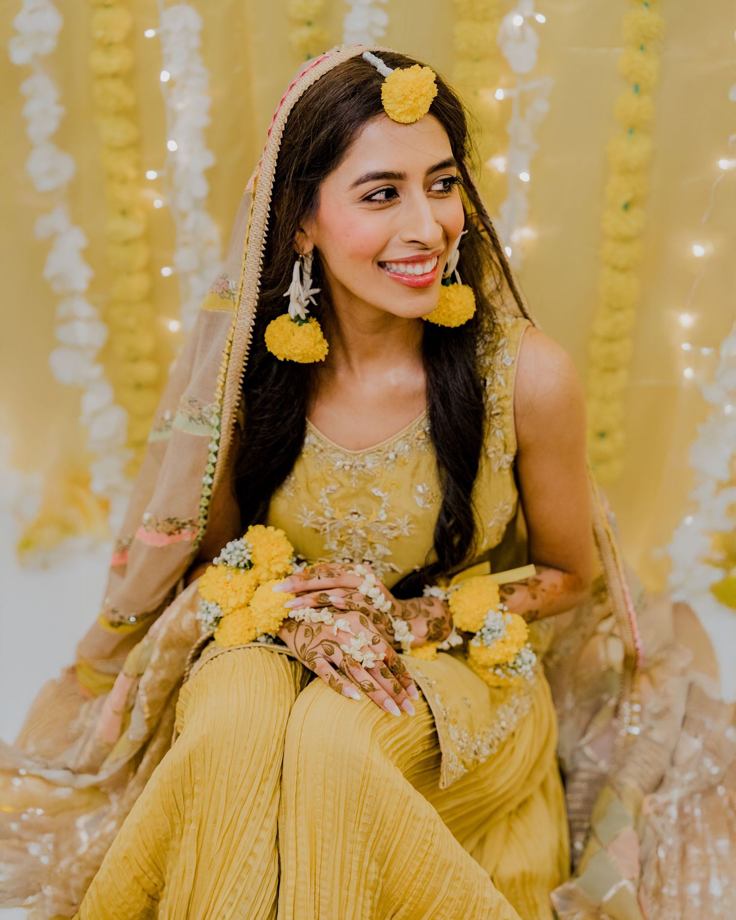 Elegant Haldi bridal portrait during traditional pre-wedding ceremony