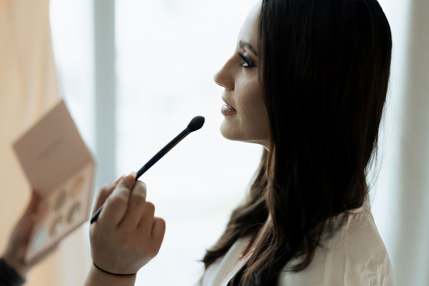 Bride getting ready moment before wedding ceremony